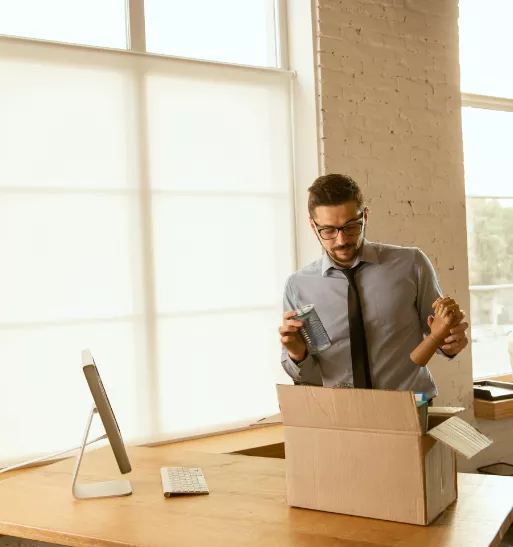 Man putting items in a box