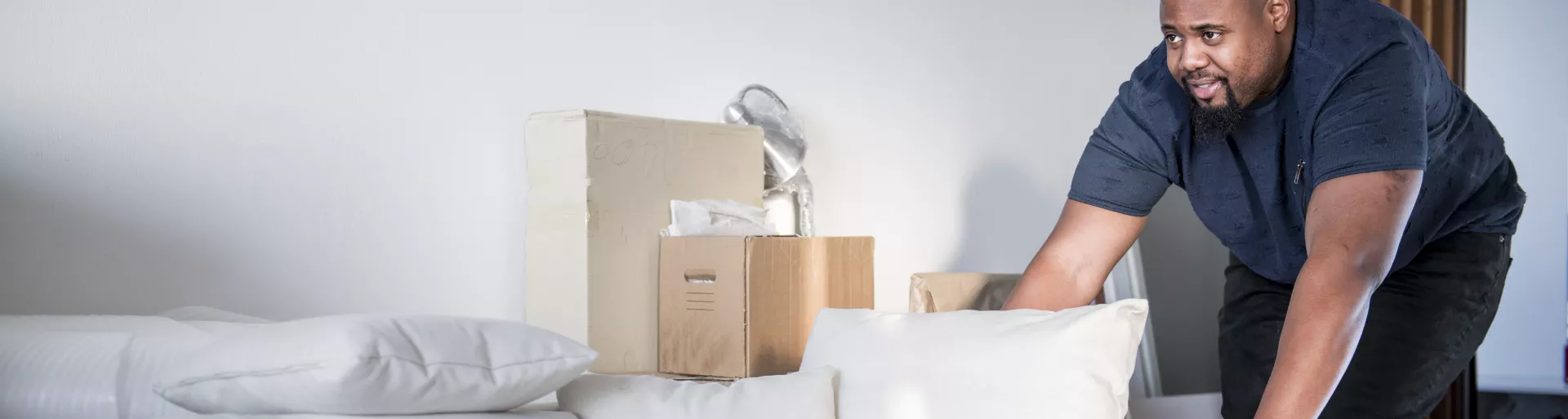 Man pushing a cart with boxes